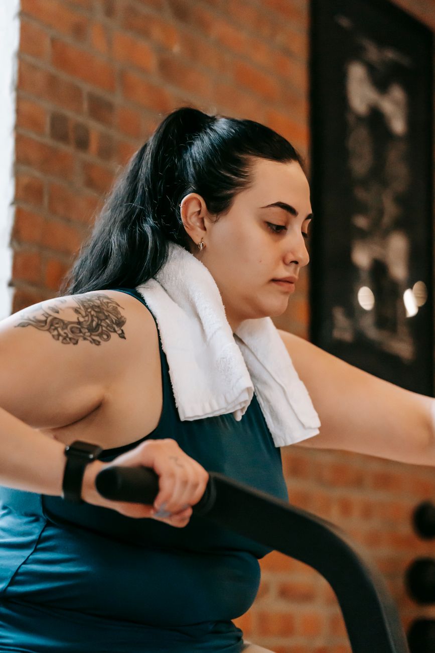 a woman exercising on fitness equipment